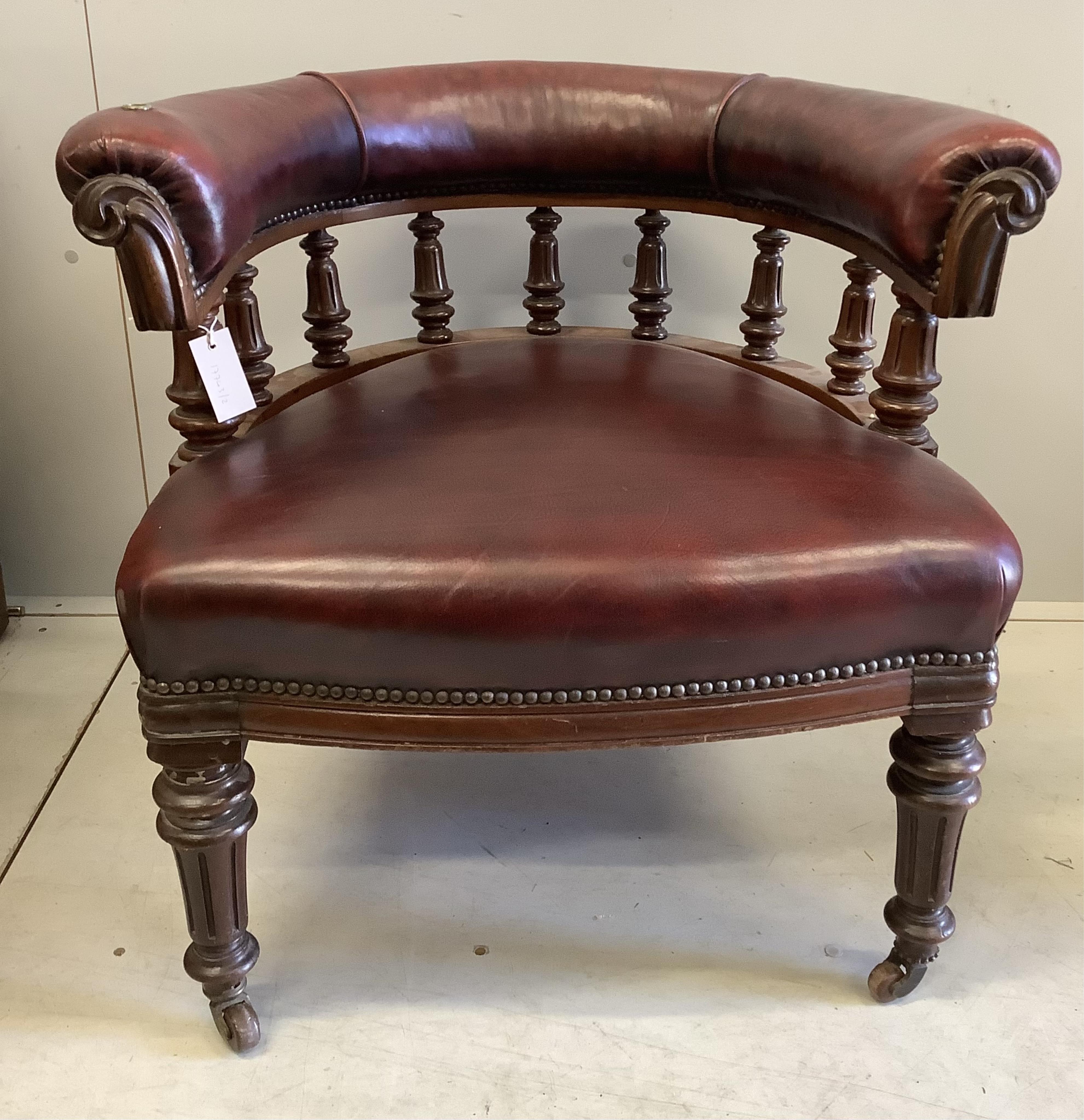 A Victorian walnut burgundy leather club chair, width 75cm, depth 64cm, height 70cm. Condition - good, although lacks reading stand